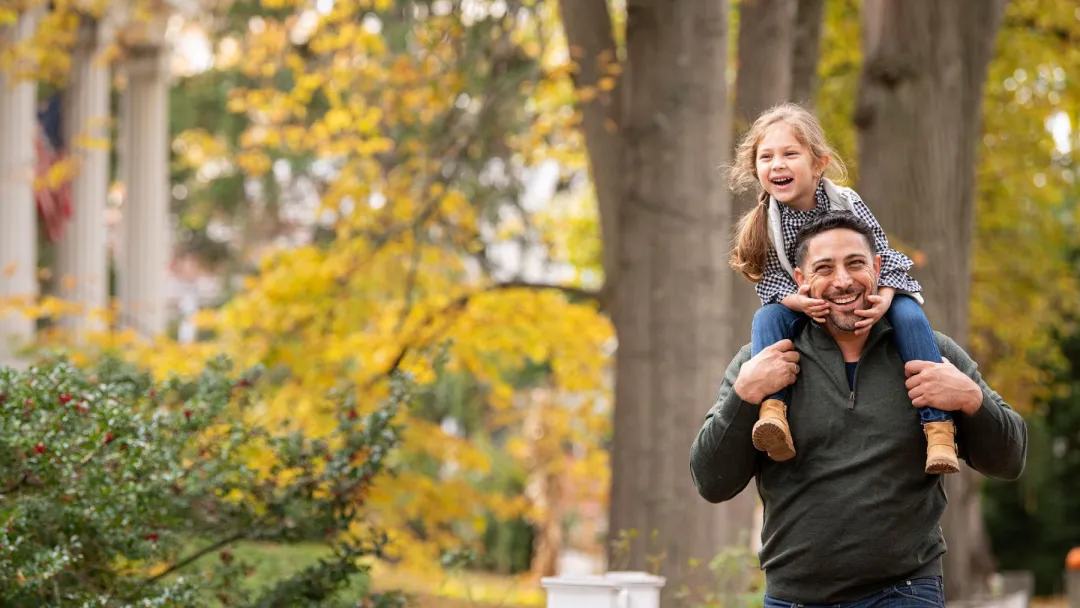 Father and Daughter walking outdoors