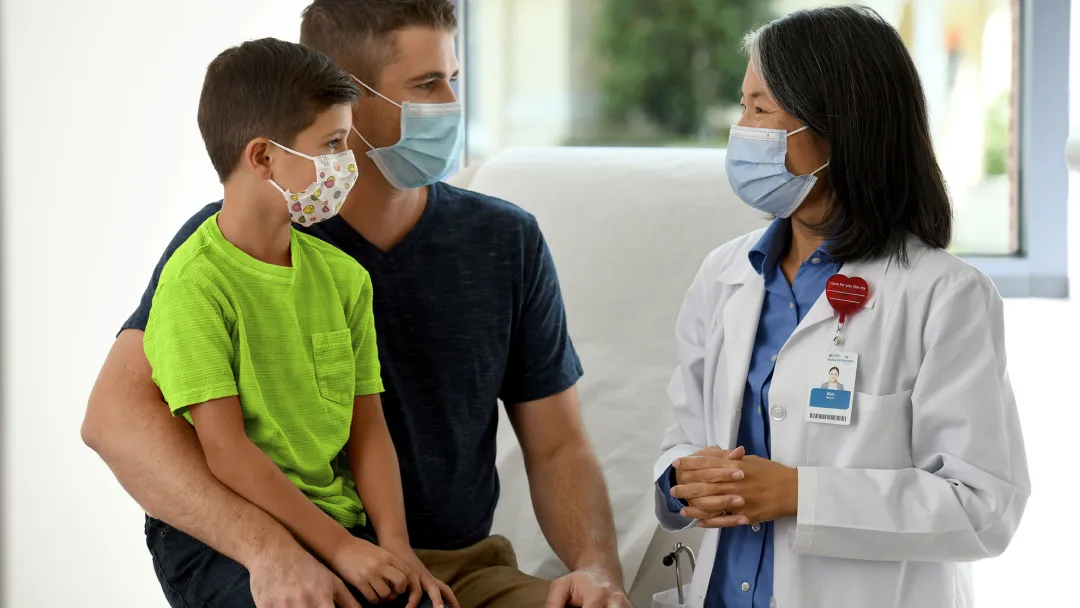A father talking to a pediatric doctor