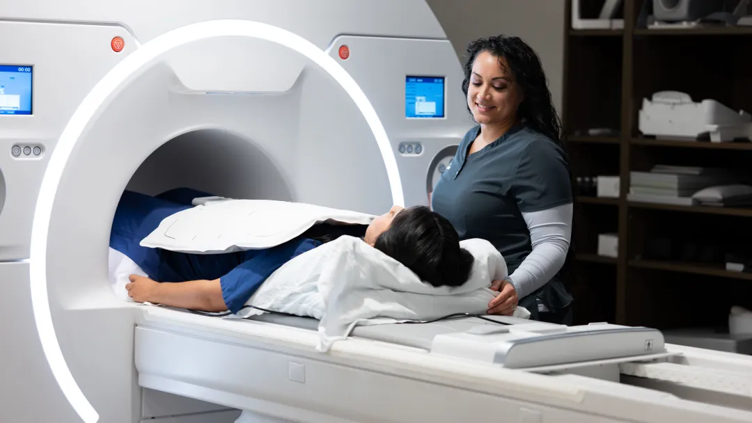Patient in MRI machine with physician