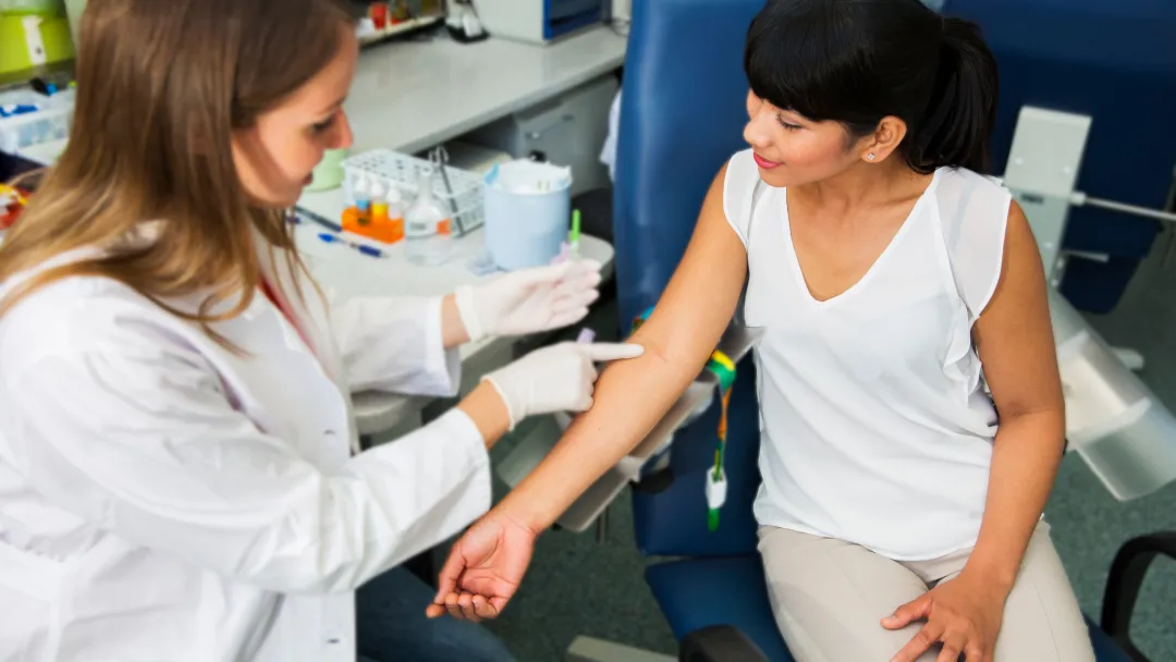 Woman Prepares to Have her Blood Drawn