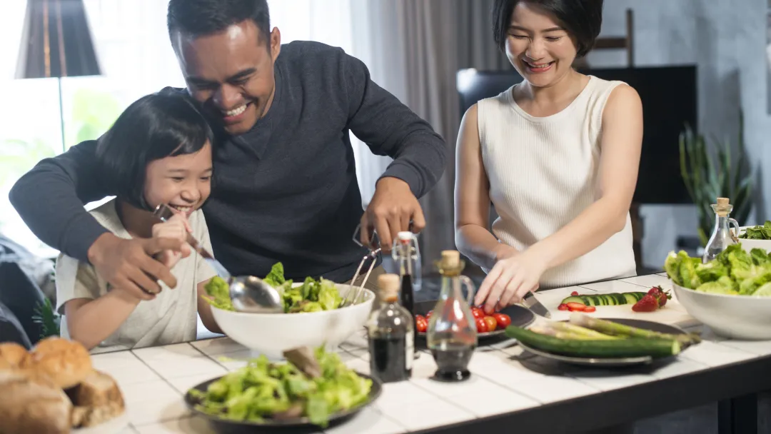 A family makes a meal together