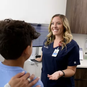 A Nurse Speaks to a Mother and Son