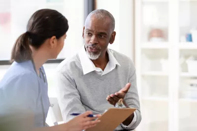 A Patient Speaks with a Provider in an Exam Room of a Medical Practice. 