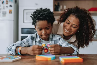 A Mother and Child do Arts-And-Crafts in the Family Kitchen