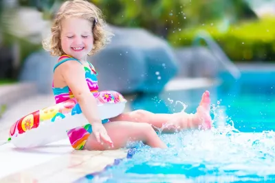 Little girl swimming in pool
