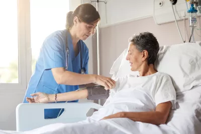 nurse and patient in hospital room