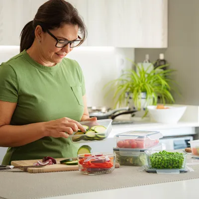A woman preparing food in the kitchen.