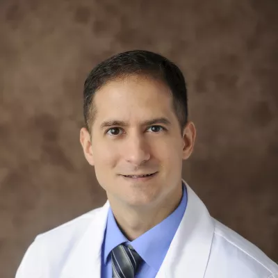 Professional headshot of Enrique Vega