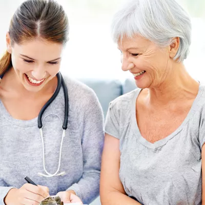 A woman goes over her lab results with her doctor.