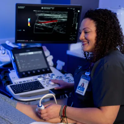 Physician scanning patient with imaging software