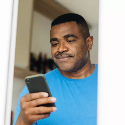 Man reading iPhone 