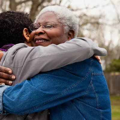 Woman Hugging Family Member