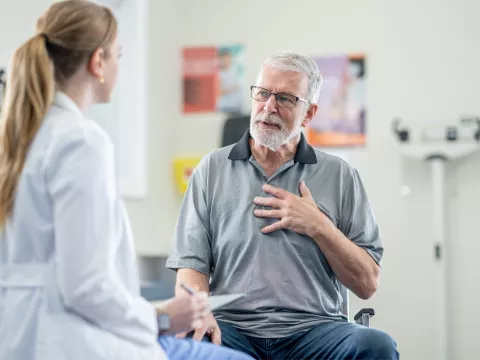 A Senior Patient Speaks to His Physician is an Exam Room