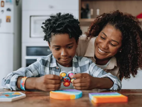 A Mother and Child do Arts-And-Crafts in the Family Kitchen