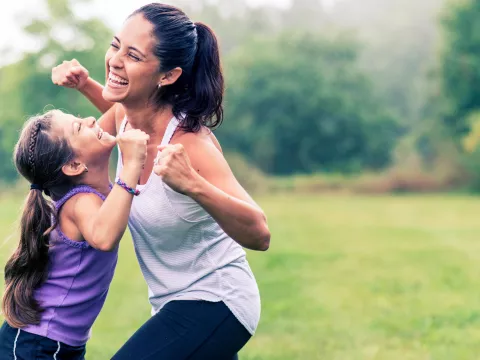 A mother and daughter get active together.