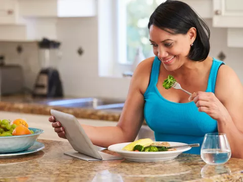 A woman views her lab results on the AdventHealth app