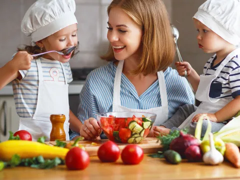 A mom teaches her little ones good nutrition habits.