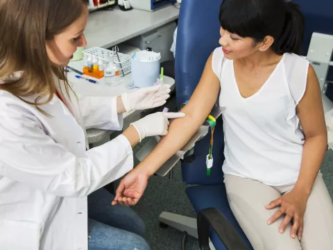 Woman prepares to have her blood drawn