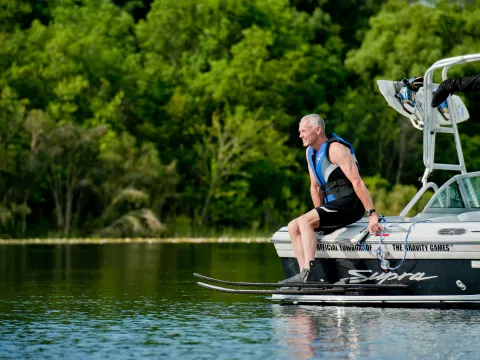 Man water skiing on lake.