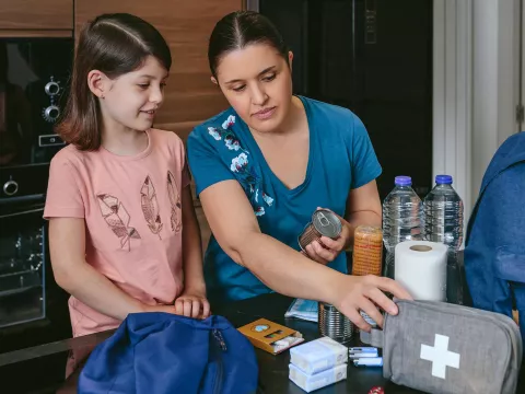 Mom and daughter pack ER go bag