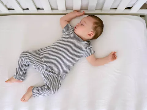 Cute Baby Sleeping In Bed