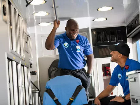 EMS workers in the back of an ambulance.