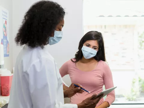 Doctor Talking to a patient about mammogram results.
