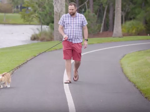 AdventHealth patient Chris Cooper walking his dog