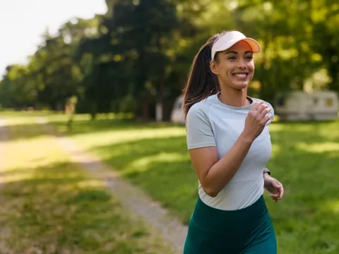 A Woman Goes For a Run in Park