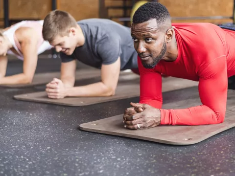 A group exercise class builds core strength.