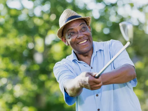 A man swinging a golf club.