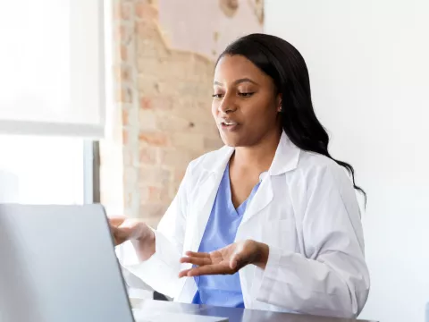 A doctor engaged in a virtual conversation