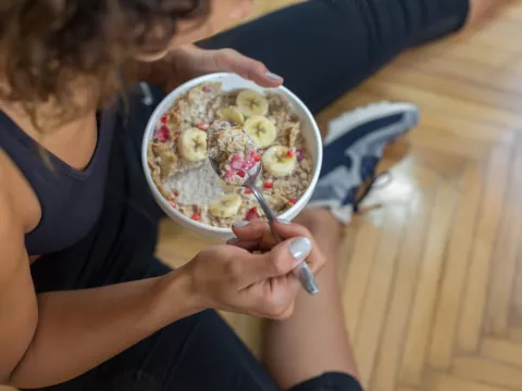 A woman eating a healthy breakfast.