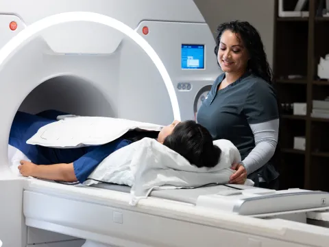 Patient in MRI machine with physician