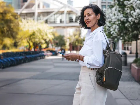 a woman walking in a metropolitan city
