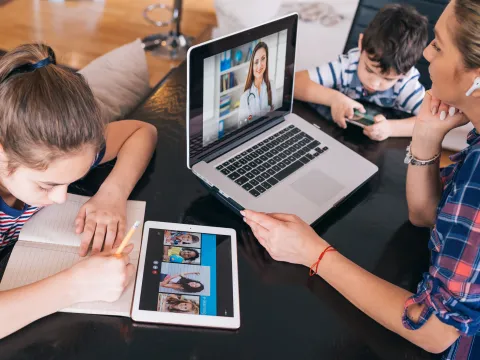 Mom on video visit with physician
