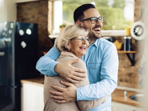 Mother and adult Son hugging