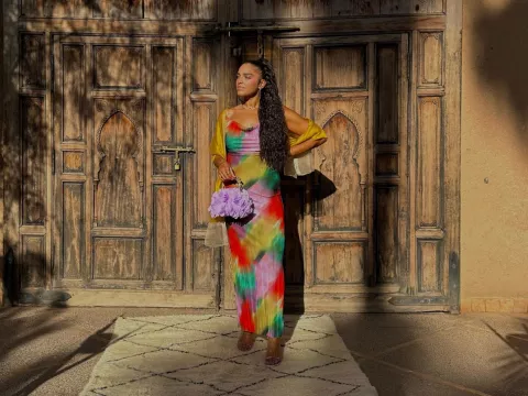 Sharlene after bariatric surgery, standing in front of a building