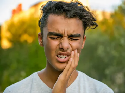 Young Man With Toothache Emergency