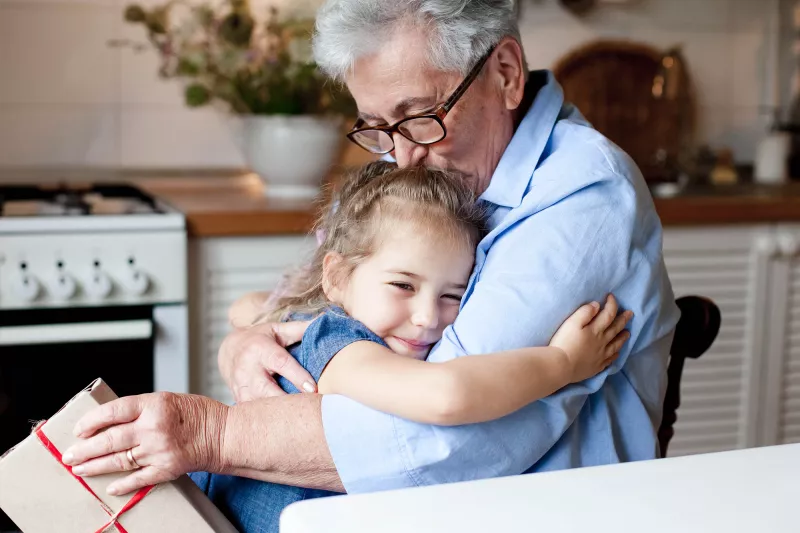 Grandfather soothes young child