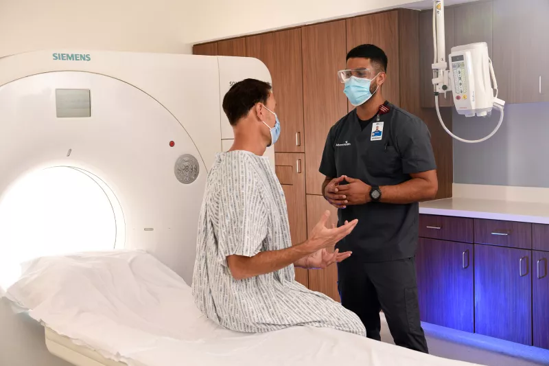 A patient talking to a PET specialist