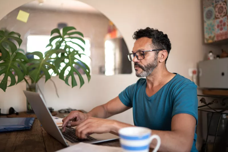 A mature gentleman on his laptop