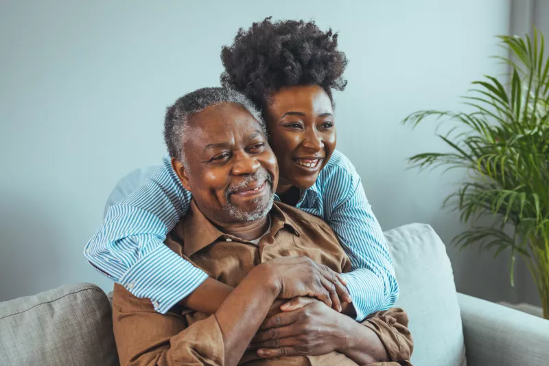 A Daughter Hugs Her Senior Father