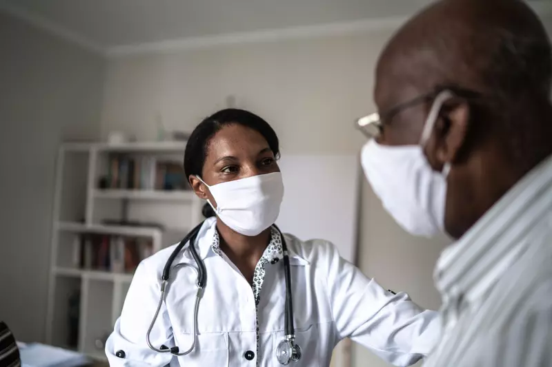 A Doctor Consoles a Patient in her Office