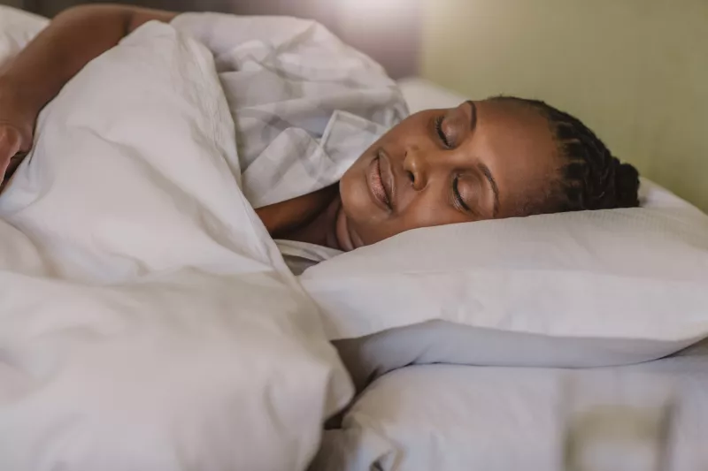 A Woman Sleeps Soundly in Her Bed