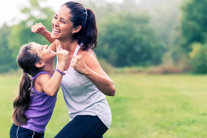 A mother and daughter get active together.