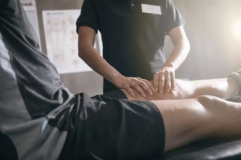 A patient getting a leg massage.