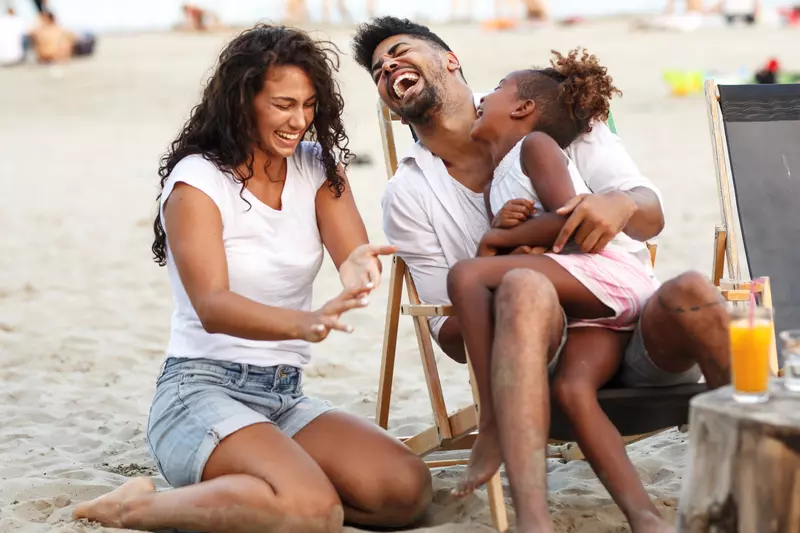 Family enjoying the beach in summertime.