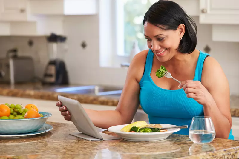 A woman views her lab results on the AdventHealth app