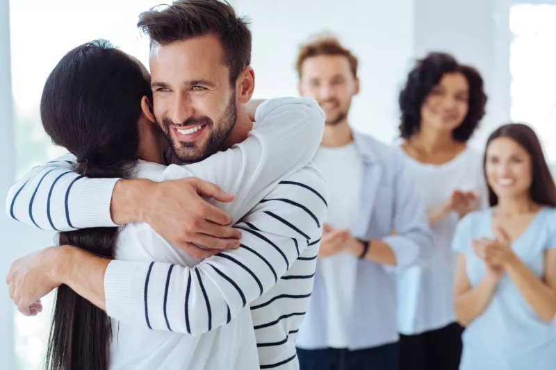 A organ donor hugs someone they helped save with a living donation.
